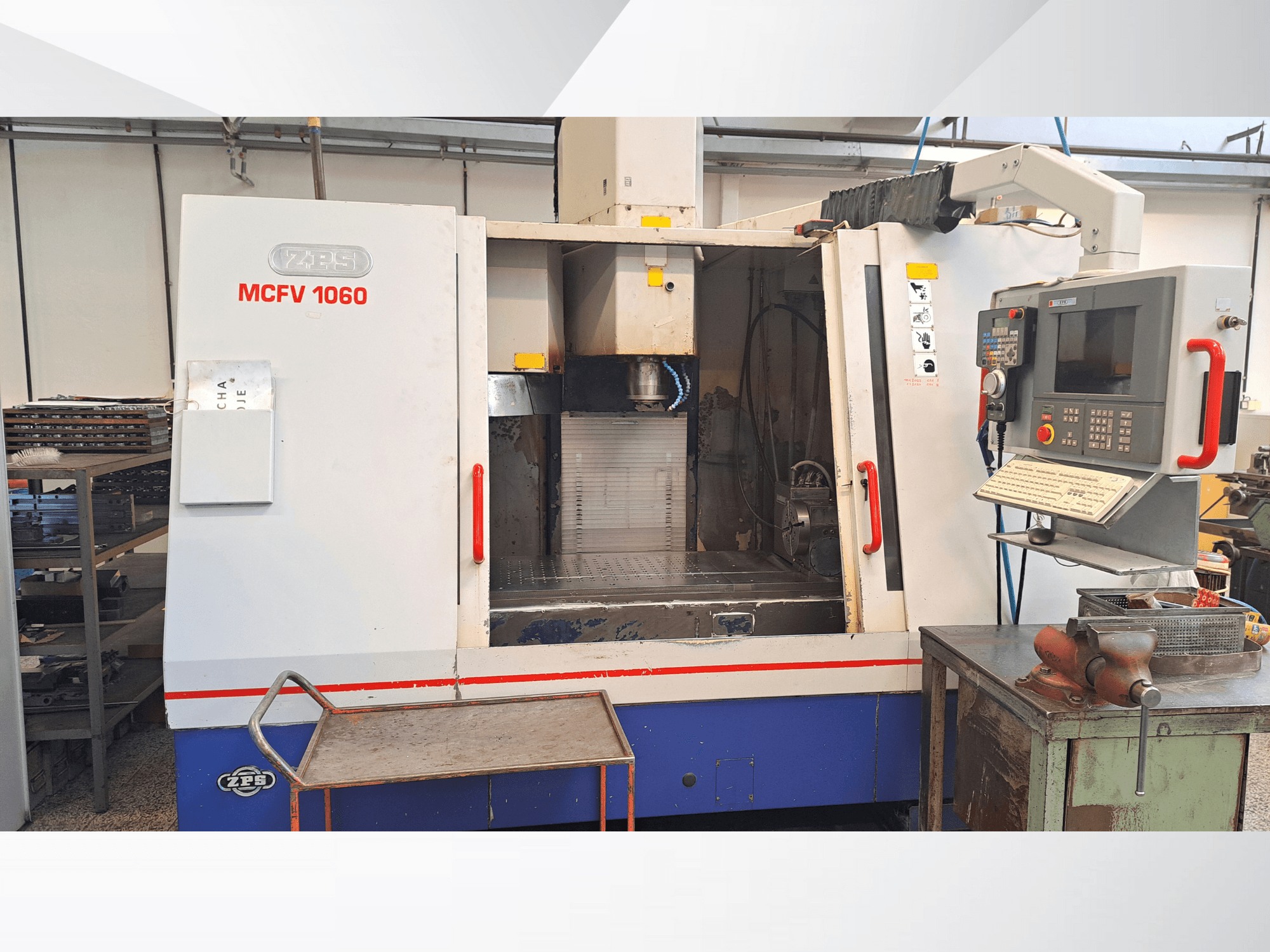 ZPS MCFV 1060 CNC machine in a workshop, front view showing control panel, spindle, and work area; metallic gray and blue colors.