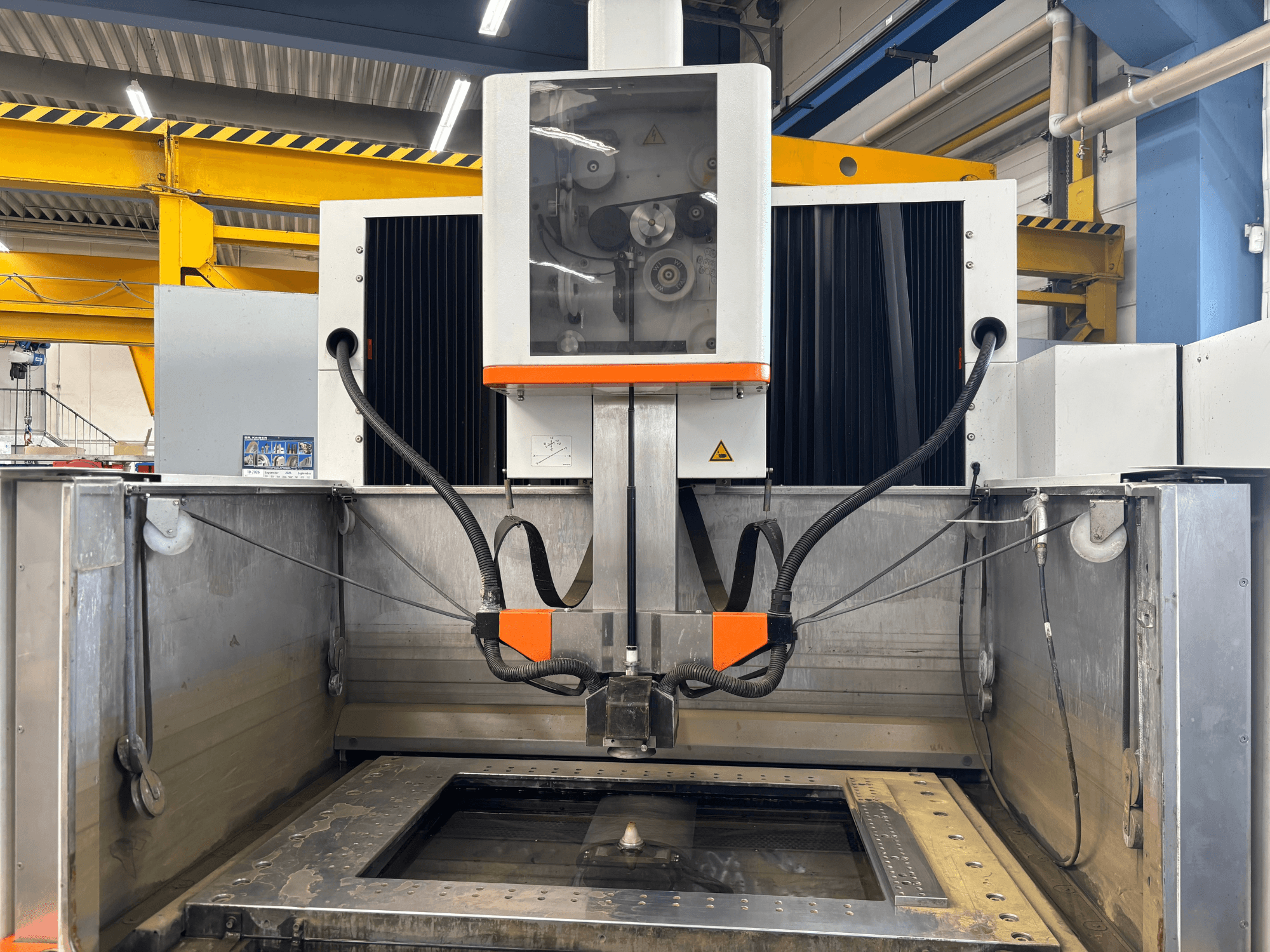 Wire EDM machine +GF+ AGIECHARMILLES CUT 400 Sp, front view showing work table and operating mechanisms.