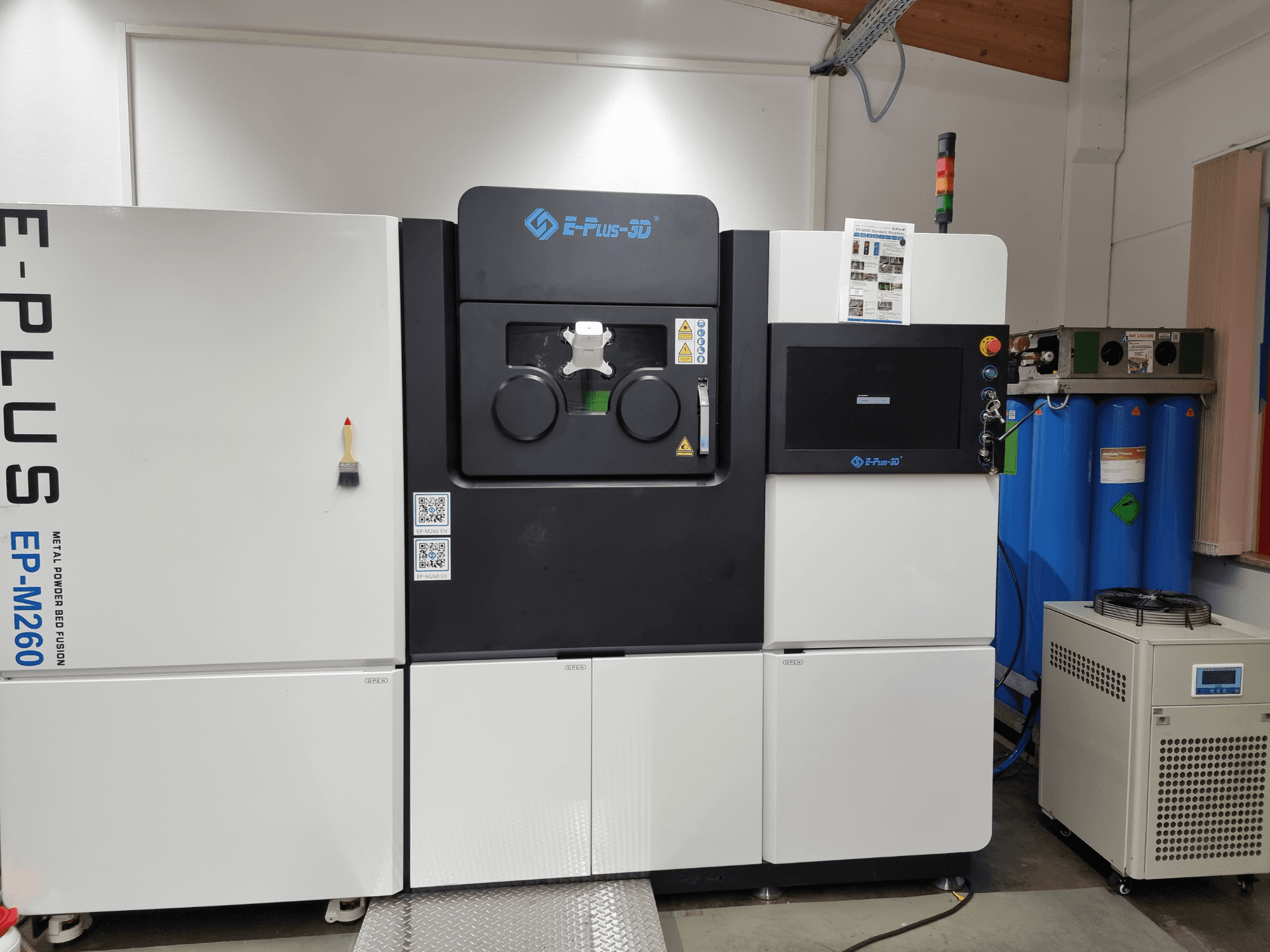 Front view of Eplus3D EP-M260 metal 3D printer, showcasing dual chambers and control panel details.