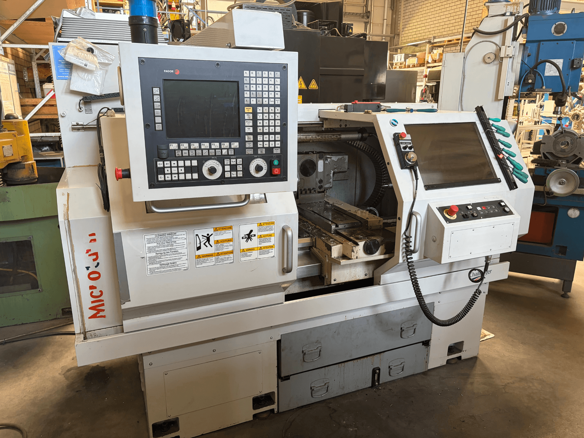 BUFFALO Microturn BNC 446 horizontal turning machine, front view, showcasing control panel, tool holder, and machine bed.