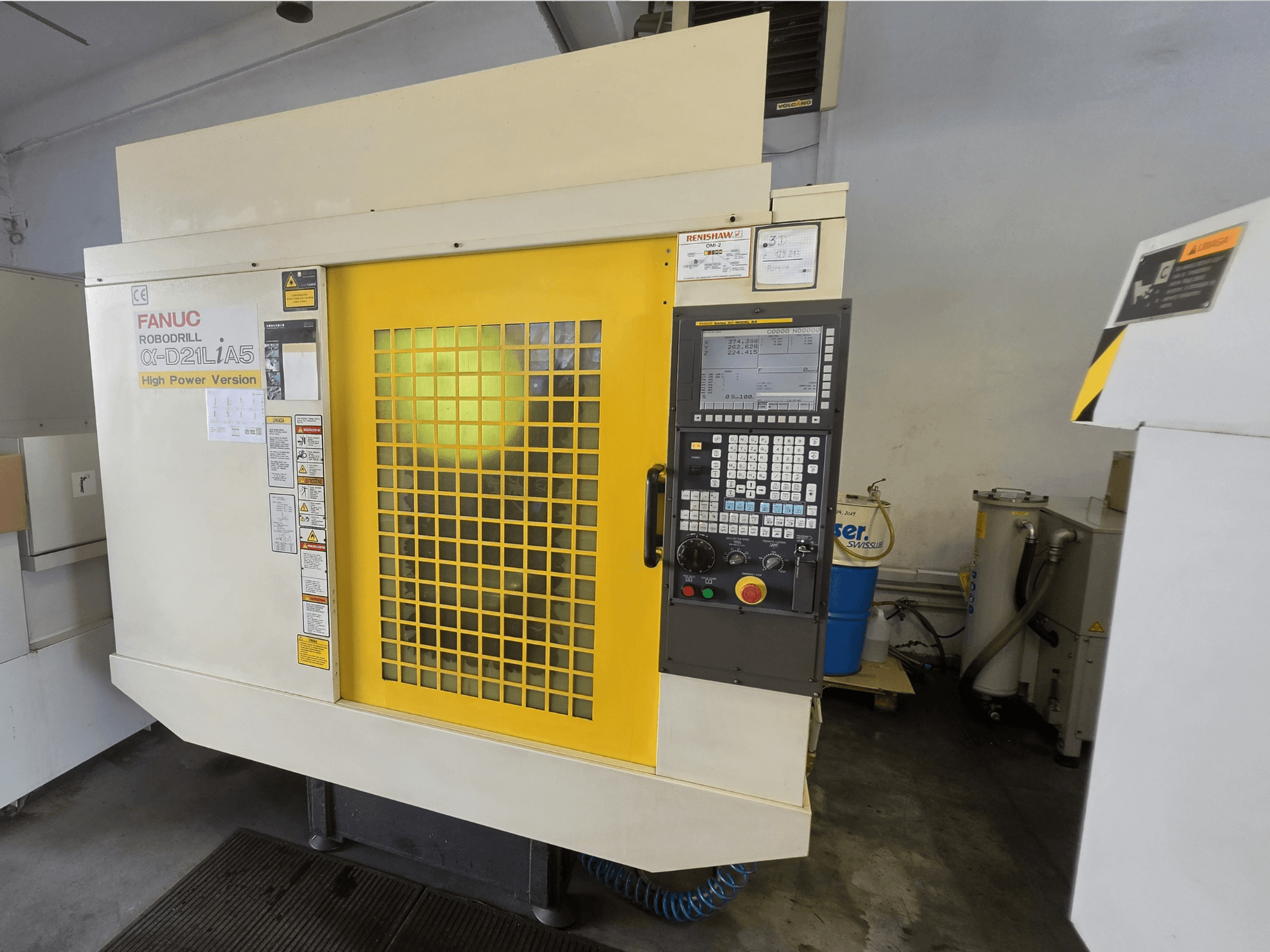 FANUC ROBODRILL alpha-D21LiA5 vertical machining center, front view, featuring yellow safety door and control panel.