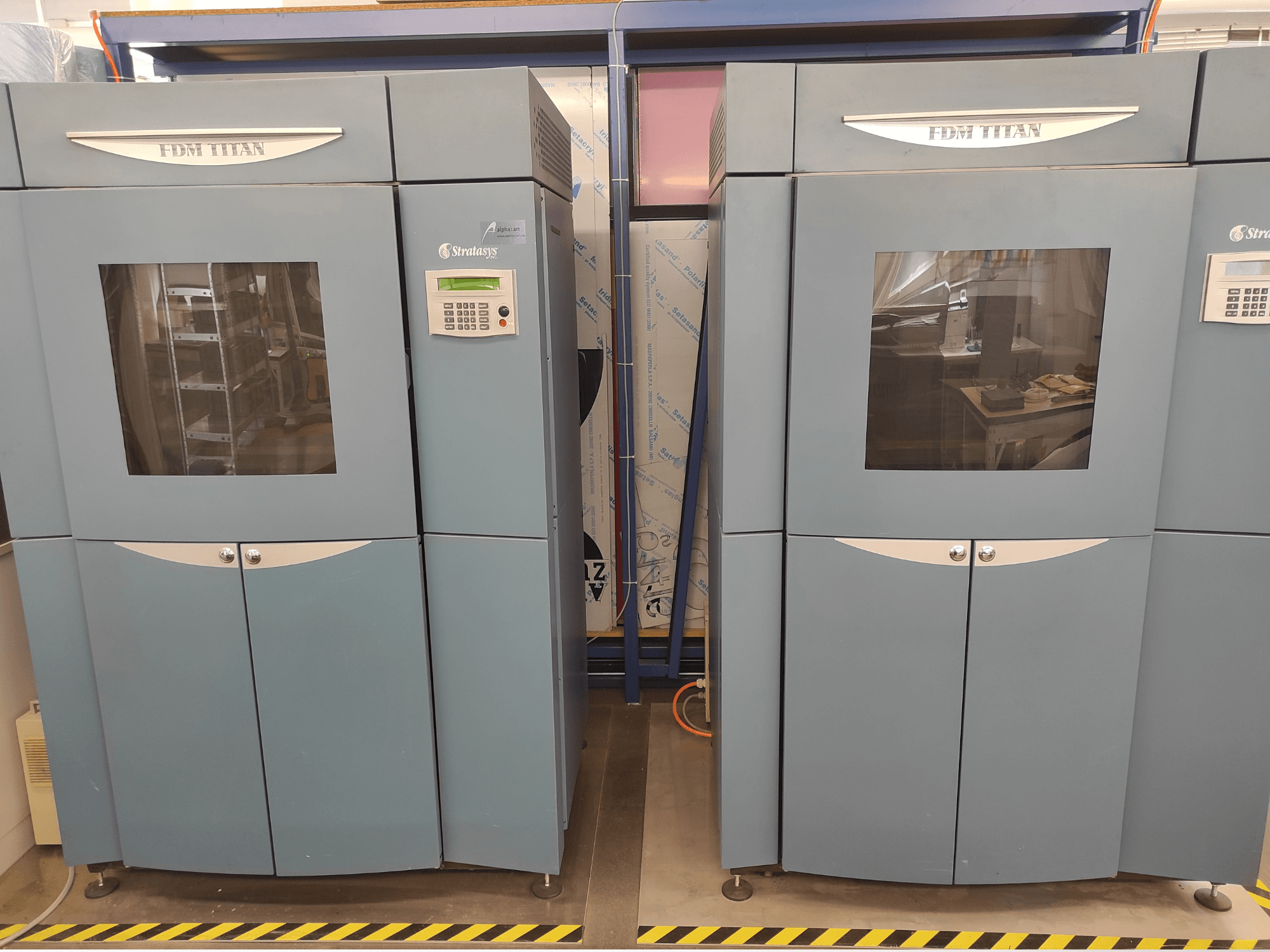Front view of Stratasys FDM TitanTI T0031 plastic 3D printer; features display panel and transparent window.