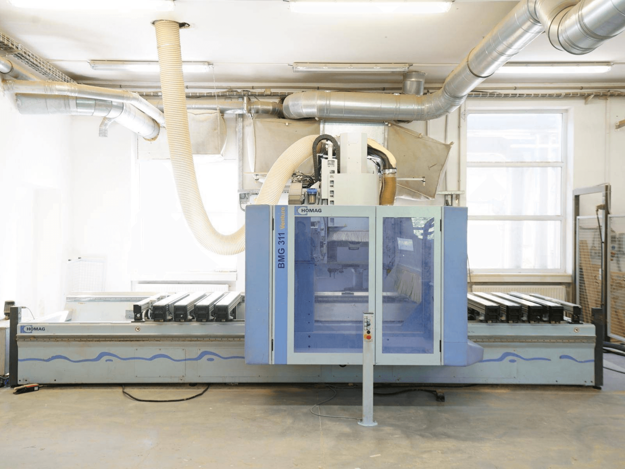 CNC Wood Machining Centre HOMAG V BMG 311/42/F/K, front view, featuring large worktable and dust extraction system.