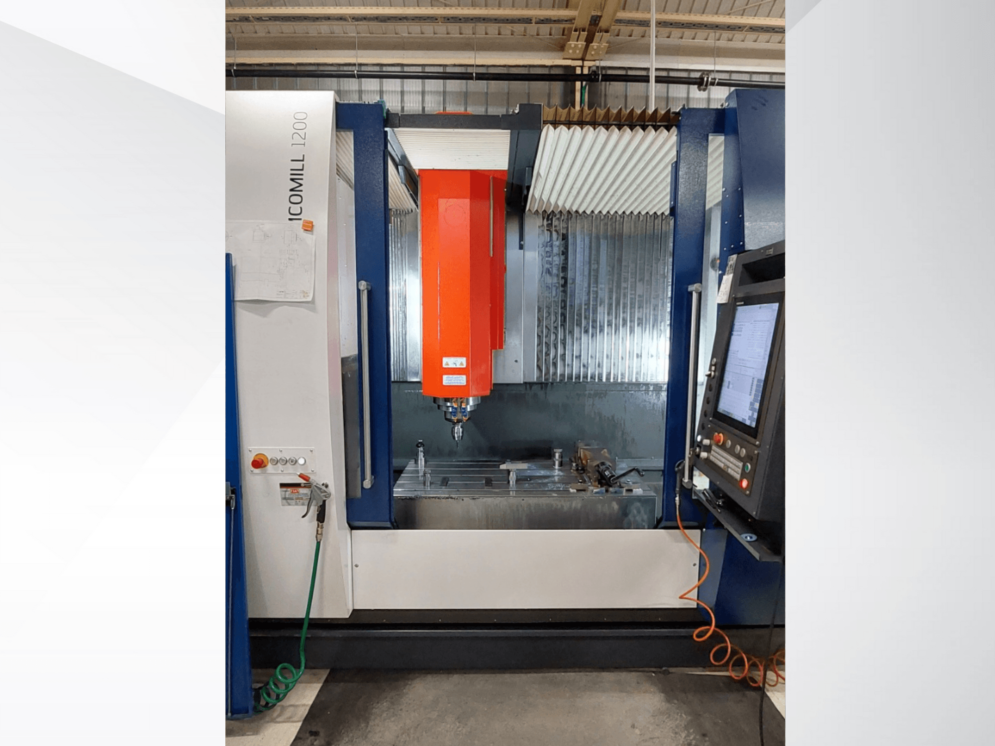 ICOMILL 1200 CNC milling machine with a red spindle, front view showing control panel and work area with tools.