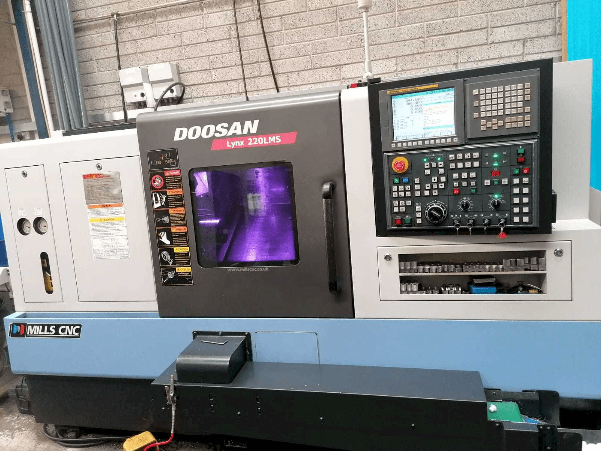 Front view of Doosan Lynx 220LMSA machine