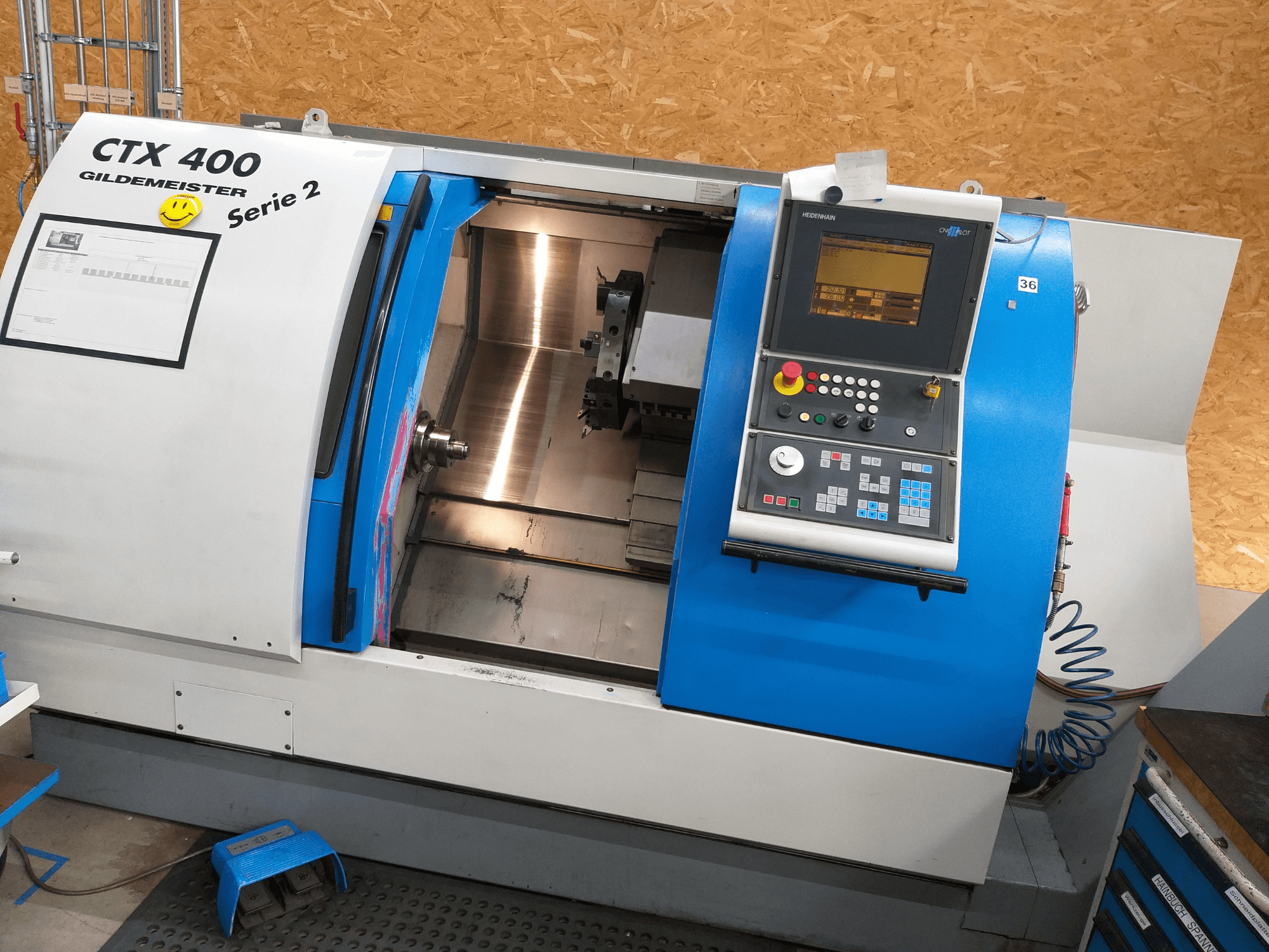 Gildemeister CTX 400 Serie 2 horizontal turning machine, front view showing control panel and open machine interior.