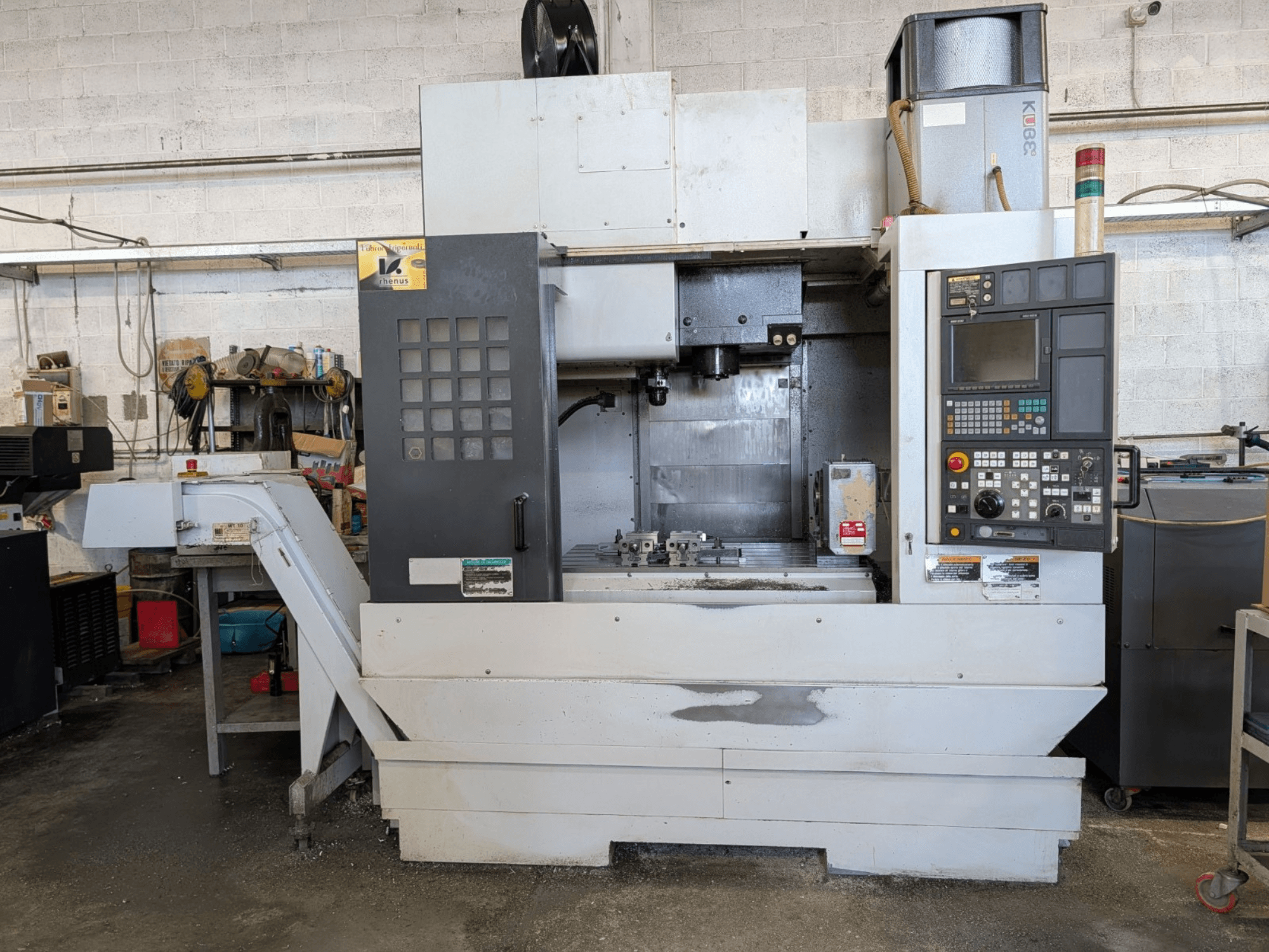 Front view of a MORI SEIKI NV-5000α1/40 vertical machining center with control panel and work area visible.