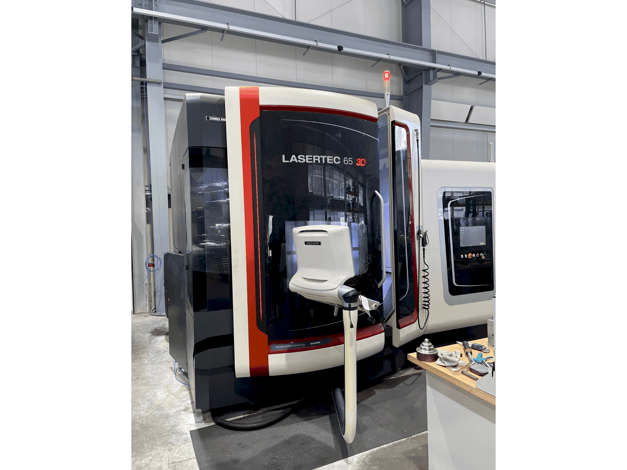 Front view of DMG MORI LASERTEC 65 3D Hybrid machine