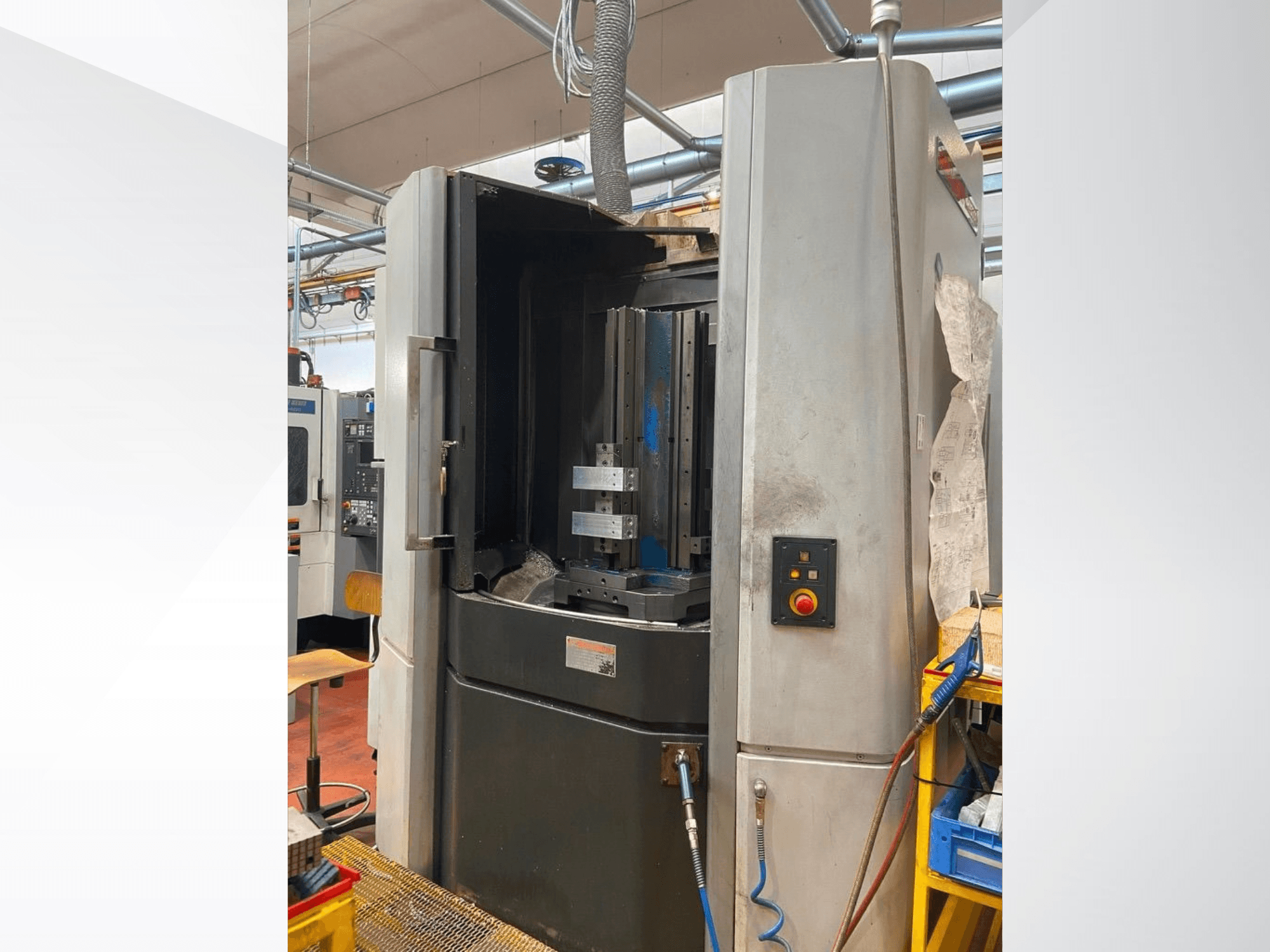 MORI SEIKI NHX 5000 horizontal machining center, front view showing open door, tool holder, and control panel.
